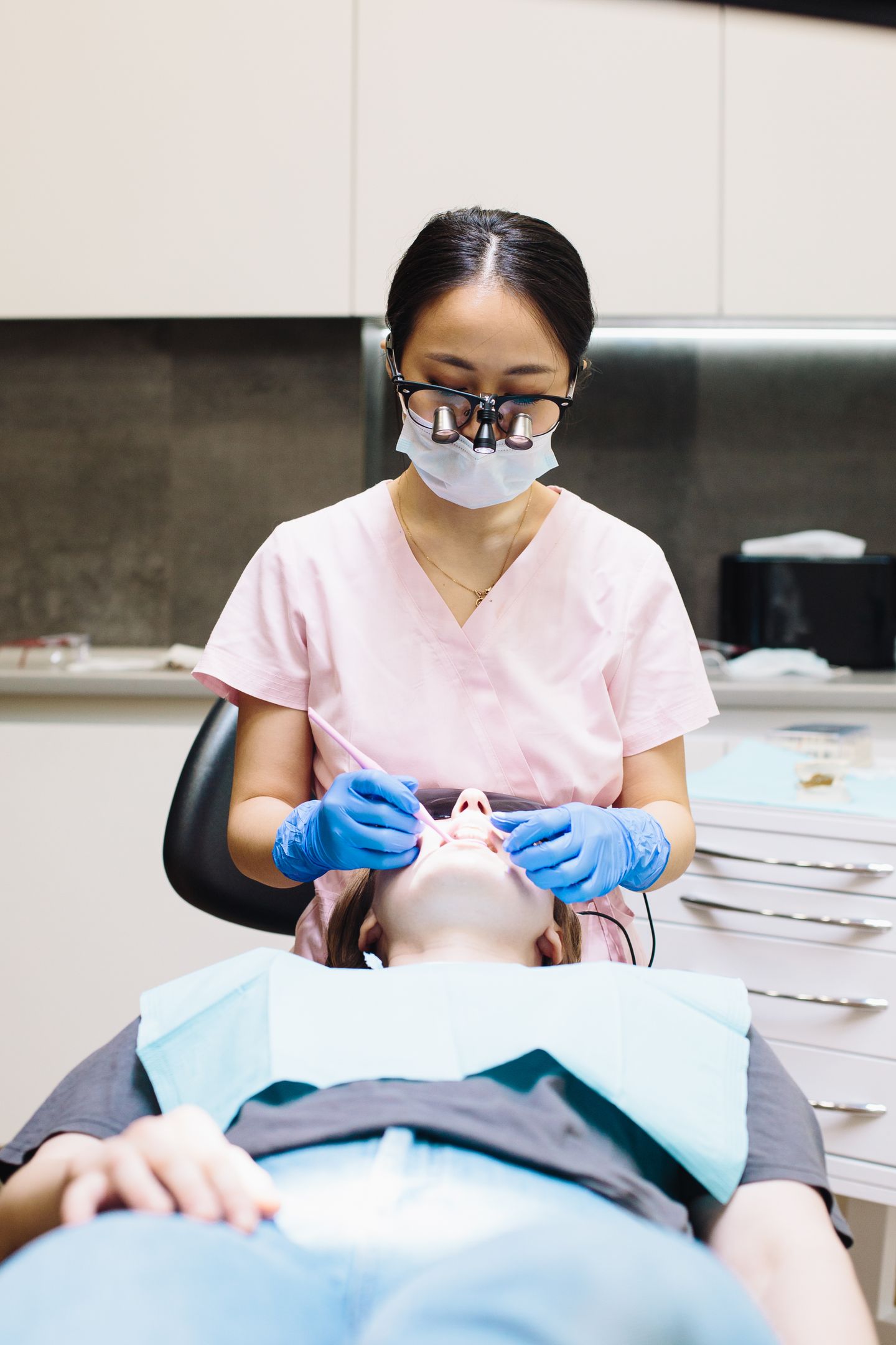 A dentist examining a patient's teeth during a check-up