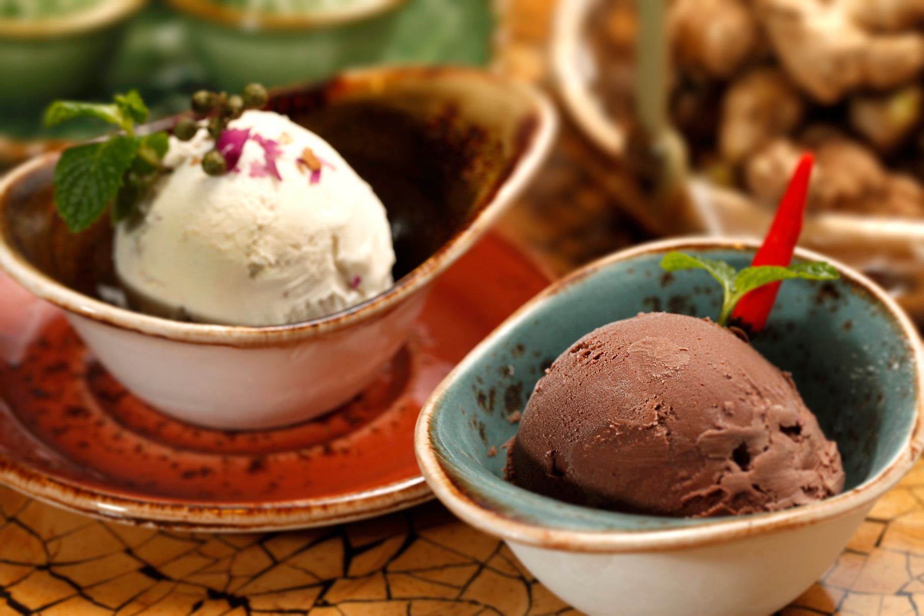 Scoops of ice cream in small bowls, a cold soft food that suits the first day after a tooth extraction