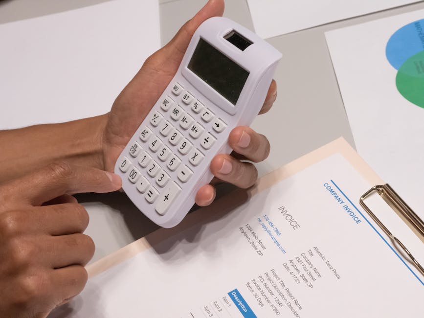 Calculator and invoice on a desk