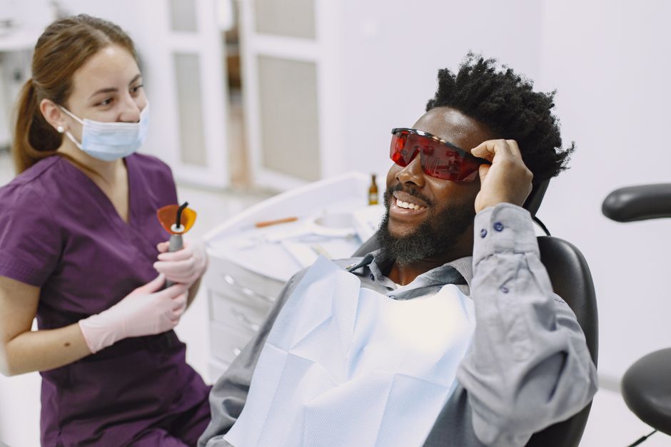 Dental patient receiving calm, comfortable treatment in the chair