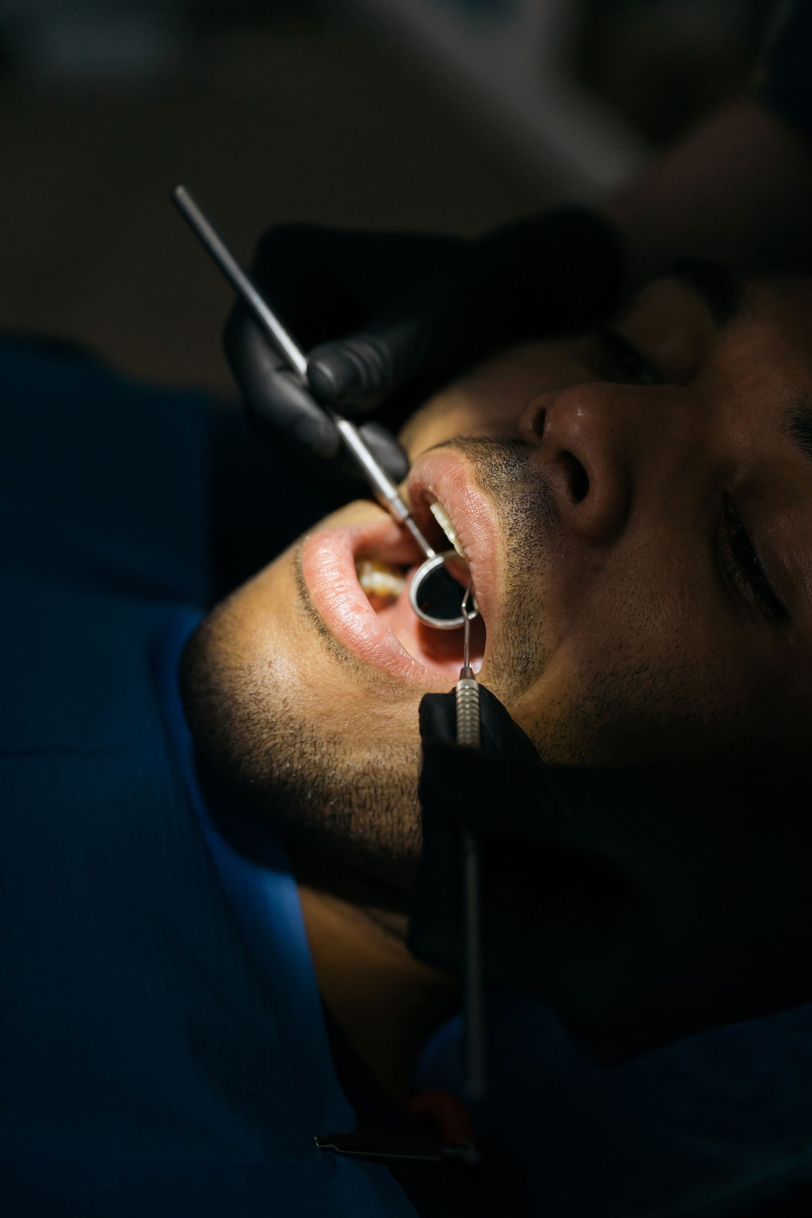 Close-up of a dental checkup examining a patient's teeth